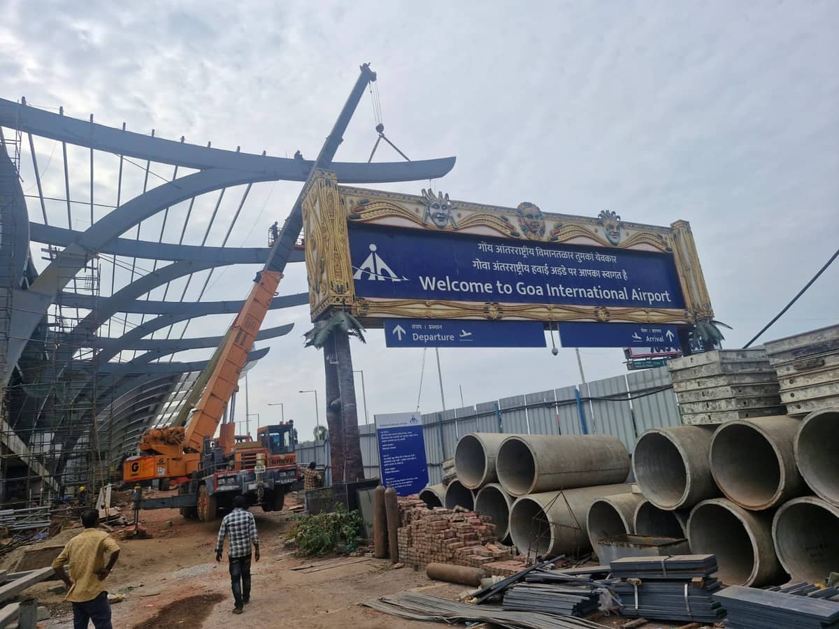Tower crane operation at commercial high-rise construction site in Panaji Goa